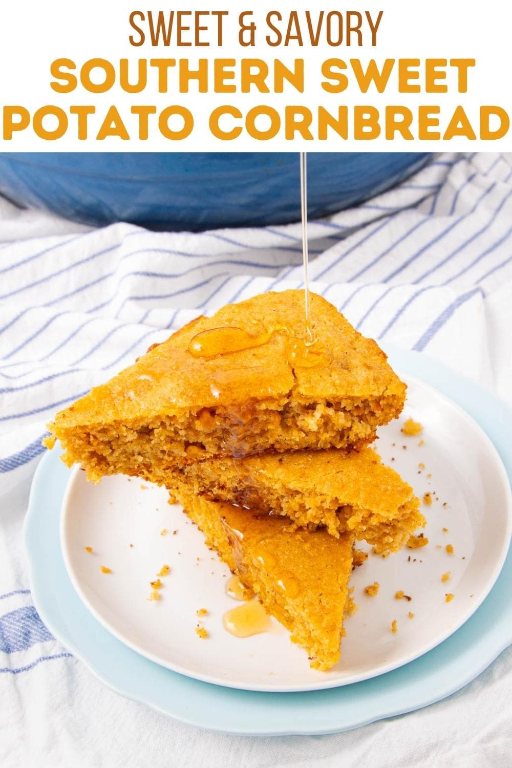 A stack of three triangular slices of sweet potato cornbread sits on a white plate, with honey being drizzled on top. The background includes a striped cloth and part of a blue bowl. Text above reads "Southern Sweet Potato Cornbread.