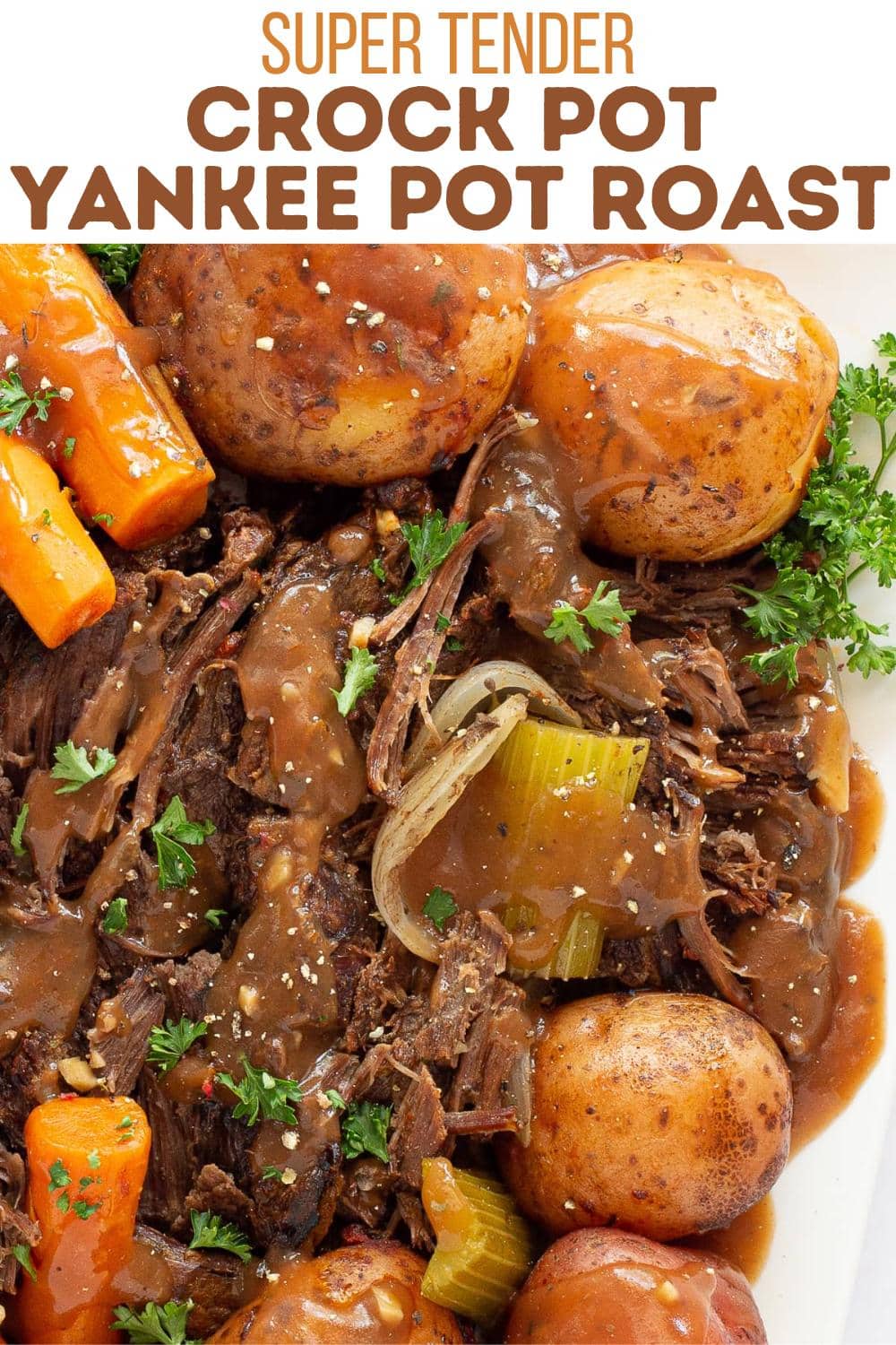 A close-up of a crock pot Yankee pot roast with tender beef, whole potatoes, carrots, celery, onions, and brown gravy, garnished with parsley. Text above reads: "Super Tender Crock Pot Yankee Pot Roast.