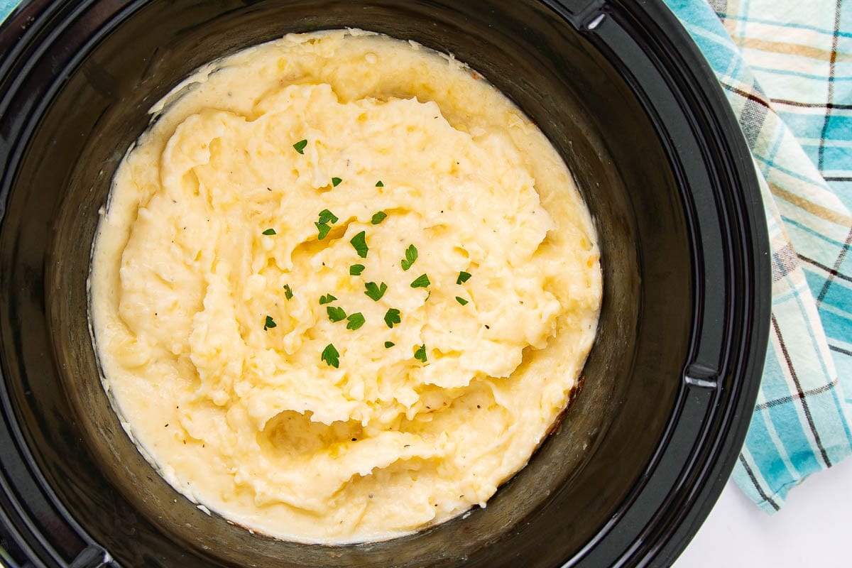 Creamy mashed potatoes cooked slowly in a crockpot.