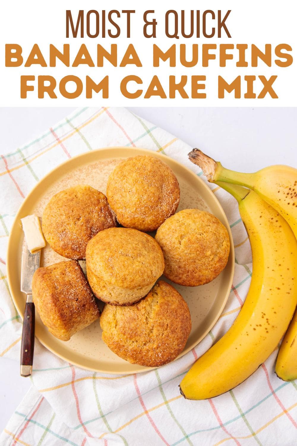 A plate of six golden banana muffins sits on a checked cloth beside two ripe bananas, a butter knife, and a small pat of butter. Text above reads, "Moist & Quick Banana Muffins from Cake Mix.