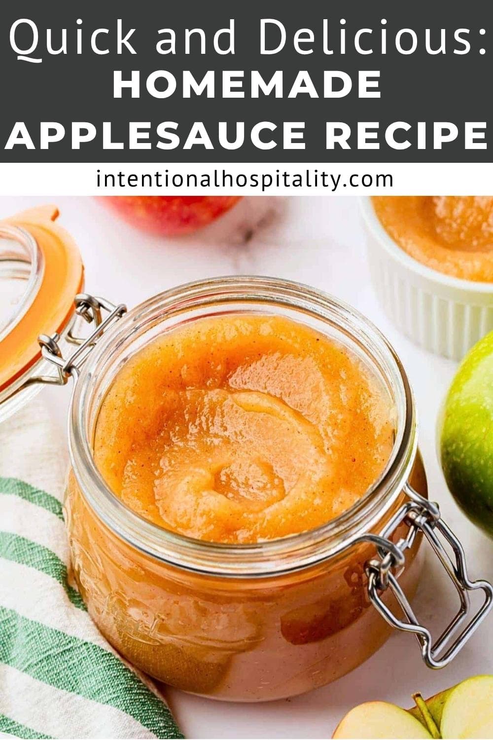 Open glass jar filled with homemade applesauce on a white surface, surrounded by a green apple, striped towel, and a small bowl of applesauce. Text above reads, "Quick and Delicious: Homemade Applesauce Recipe.