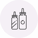 Line drawing of two condiment squeeze bottles, one shorter with diagonal lines and one taller with a circular mark on its label, both with nozzle caps.