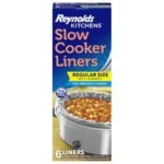 A box of Reynolds Kitchens Slow Cooker Liners, regular size for 3–8 quarts, featuring an image of a slow cooker with stew. The box highlights BPA-free liners, fast cleanup, and contains 6 liners.